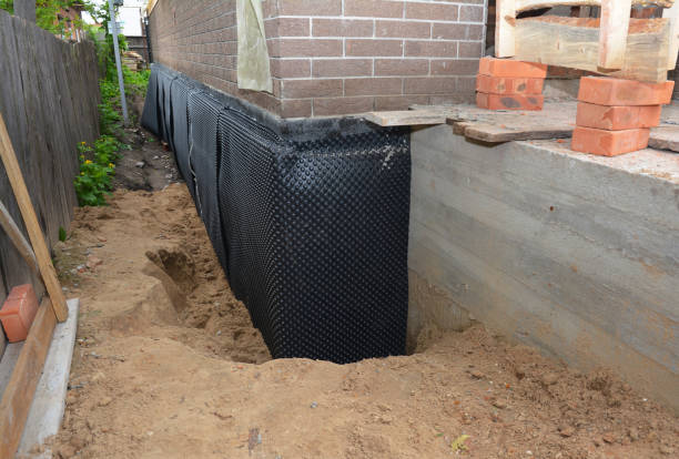 Happy homeowners after waterproofing job in Rose